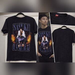 Sasuke graphic tee featuring a darker, mood-driven design with flame accents.